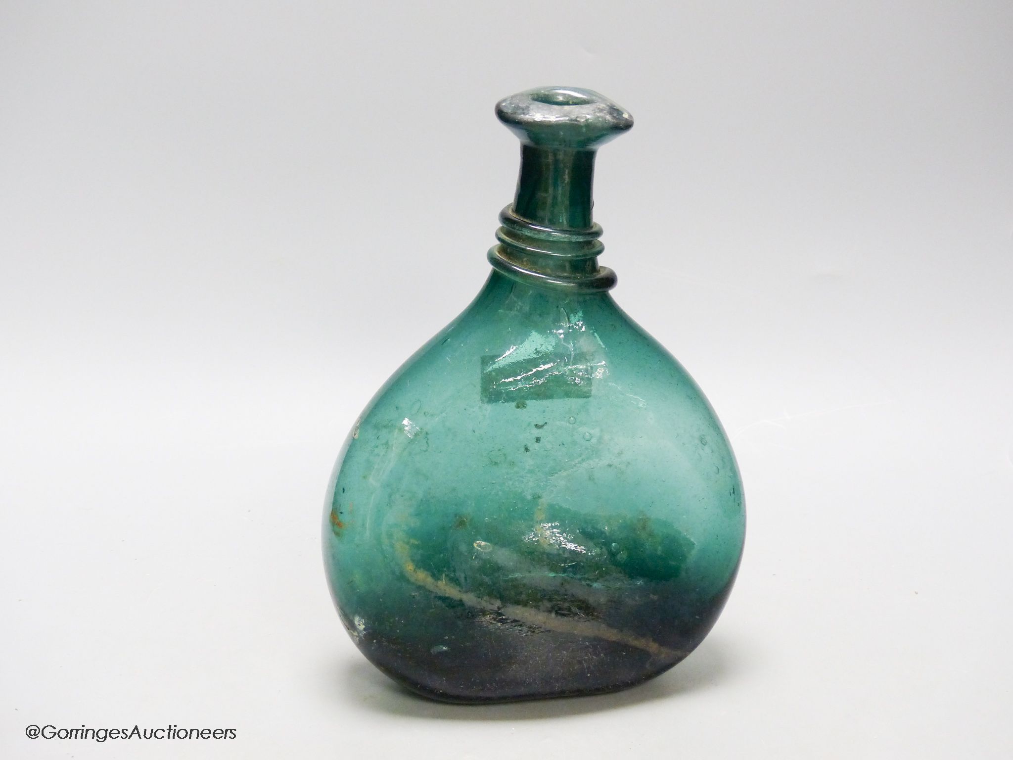 An 18th/19th century Persian green glass flask, Qajar dynasty, height 26cm